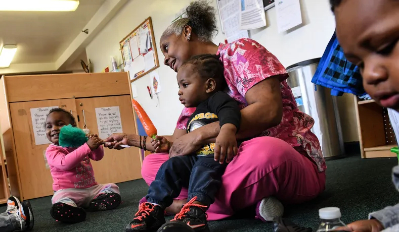Families across the United States face financial hardships as childcare funding halts. Photo: Getty Images. 