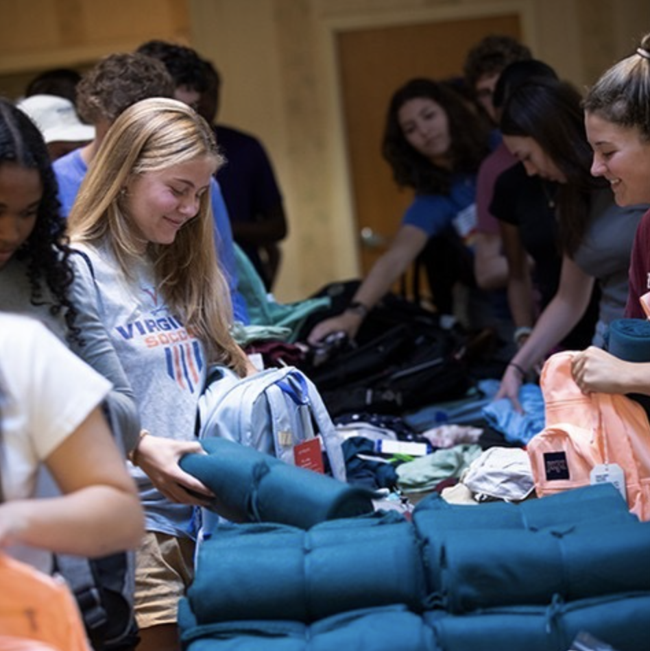 Students fill bags called comfort cases with personal items for youth in the foster care system.