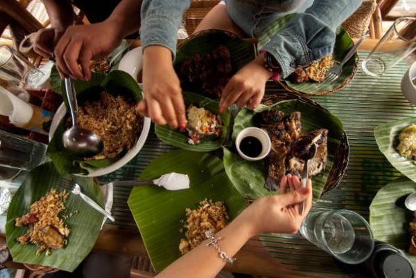 Hiraya’s menu, curated by Chef Paolo Dungca, features Filipino dishes such as chori burgers, duck adobo and buko pie, in addition to an assortment of colorful lattes. Photo: Getty Images.